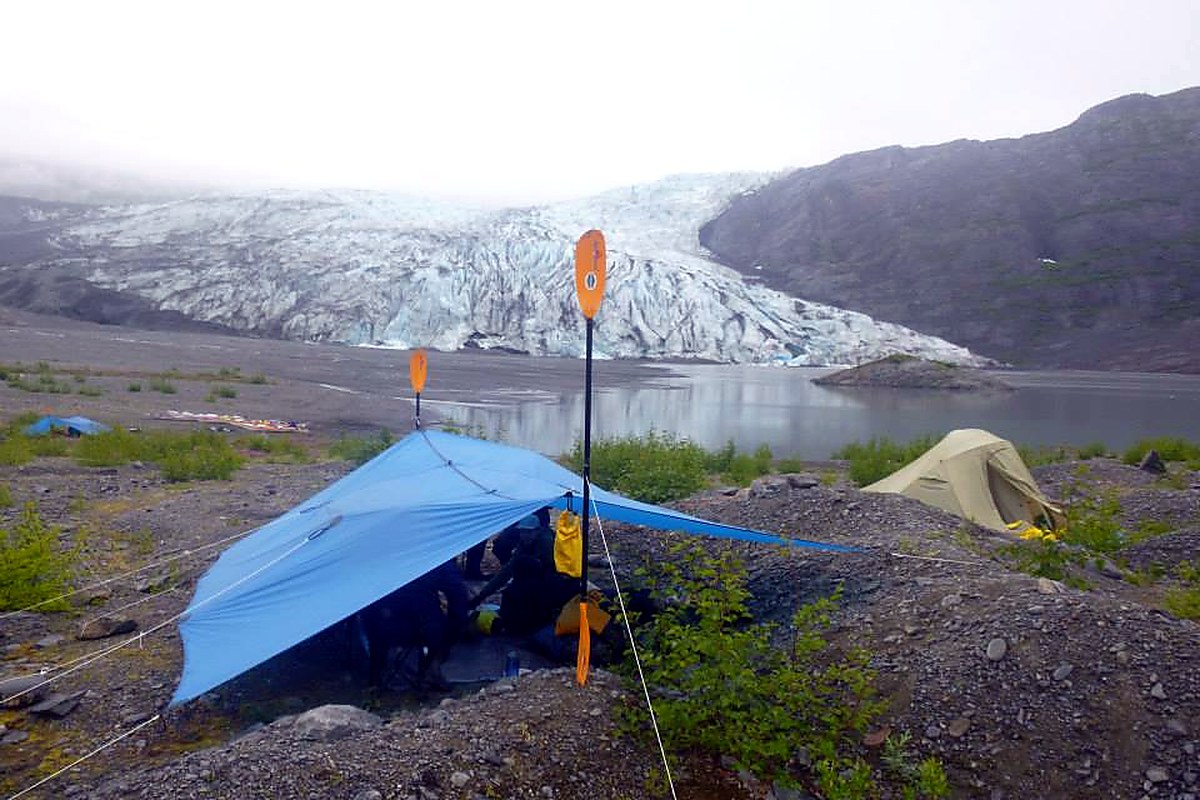 Tarp shelter rigged between trees